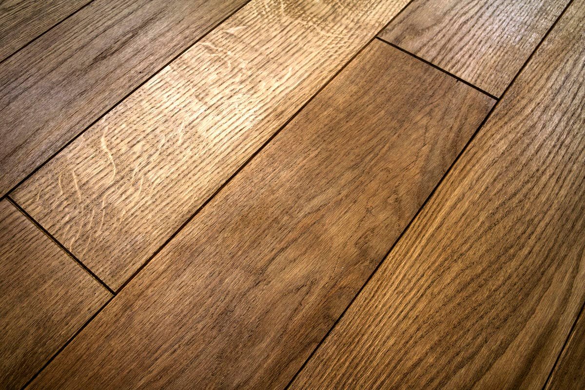 Close-up view of high-quality hardwood flooring in a modern Milwaukee bathroom